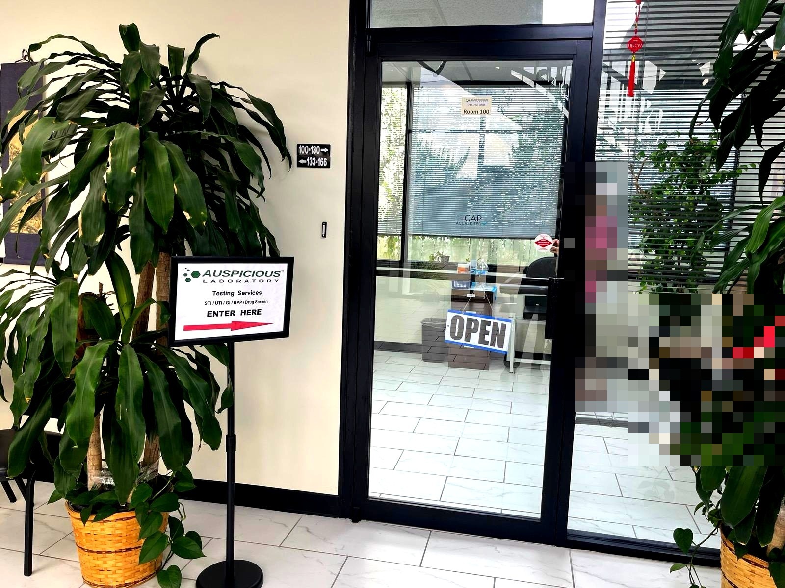 Auspicious Laboratory Room 100 entrance with Testing Services Enter Here sign